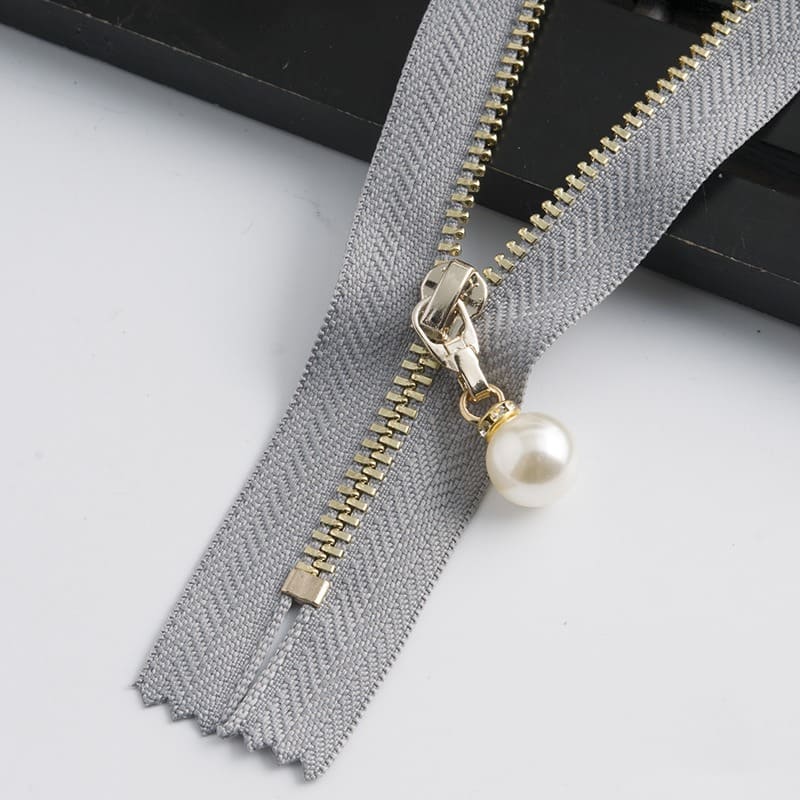 Black jacket with a custom gold brass zipper