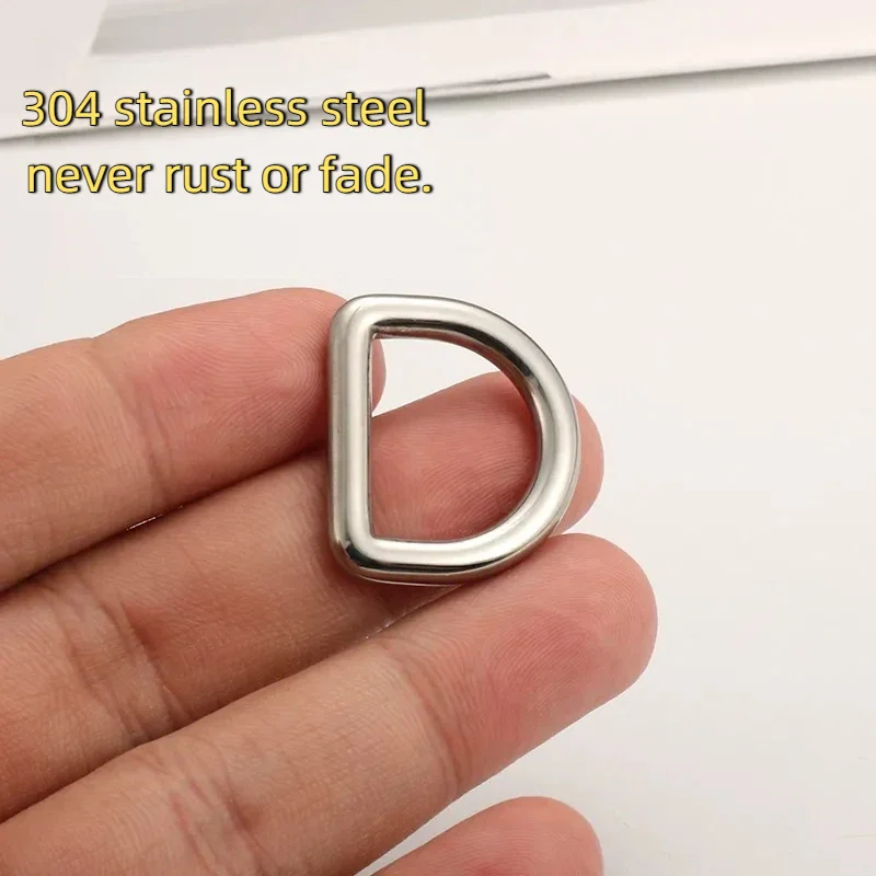 A hand holding a shiny, 304 stainless steel D-ring, known for its durability as it never rusts or fades.